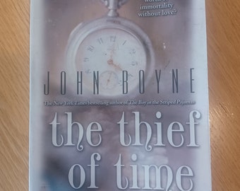 Vintage paperback book "The Thief of Time" by John Boyne.