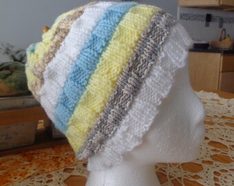 Hand knit blue, yellow and white striped hat.