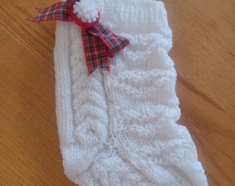 Hand knit small white aran Christmas stocking with red plaid bow and red button 9" long