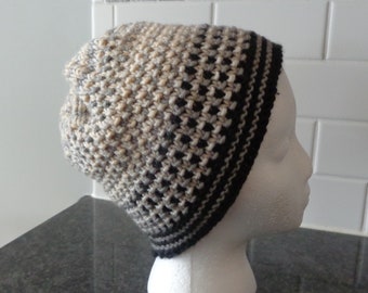 Hand knit striped hat. Black, grey, tan and beige.