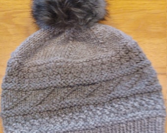 Hand knit winter hat with fake fur pompom