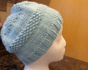 Hand knit aqua winter hat.