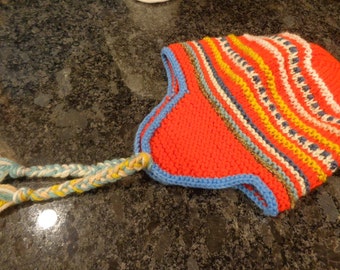 Hand knit red earflap hat. 18" around unstretched.