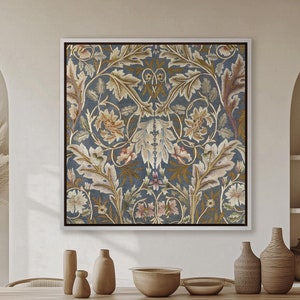 May include: A framed print of a vintage floral design with intricate details in shades of blue, green, and pink. The print is displayed on a wall in a modern dining room setting with a wooden table and chairs.