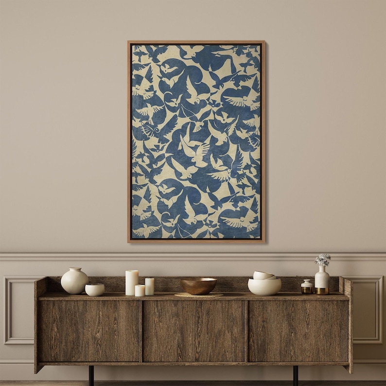 May include: A framed canvas print with a blue and white pattern of birds in flight. The background is a light beige color.