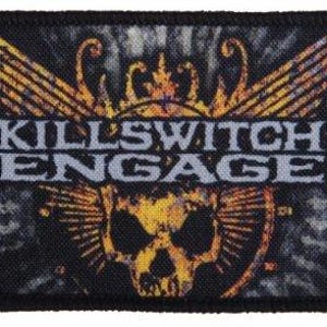May include: Black and yellow embroidered patch featuring a skull with wings. The text "KILLSWITCH ENGAGE" is in white lettering.