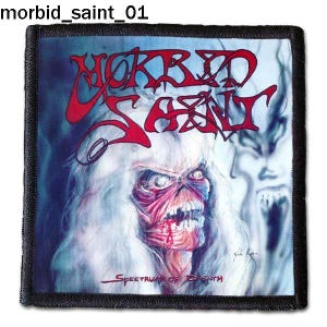 May include: A black and white patch with the band name "Morbid Saint" in red lettering. The band's logo is a skull with a red face and white eyes. The text "Spectrum of Death" is at the bottom of the patch.