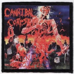 May include: A black and white patch with a graphic of a zombie with a bloody torso and a graveyard in the background. The text "Cannibal Corpse" and "Eaten Back to Life" is visible on the patch.