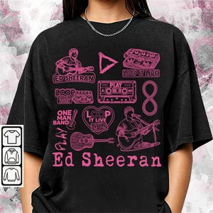 Puede incluir: Camiseta negra con gráficos rosas de Ed Sheeran, una guitarra, cintas de cassette y el texto "Ed Sheeran". El diseño incluye las frases "Loop It Live", "One Man Band" y "Loop Tour 2028".
