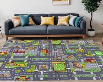 May include: A rectangular area rug featuring a colorful city map design with gray roads, green parks, various buildings, and roundabouts. The graphic print includes illustrations of houses, a construction site, and trees on a dark gray background.
