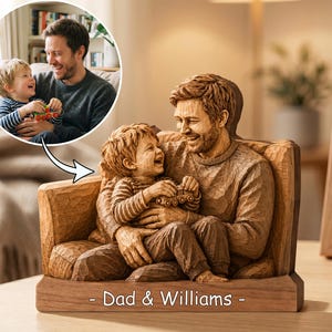 May include: A wooden sculpture of a father and child laughing together, seated in a carved armchair. The sculpture is brown with visible wood grain. The base of the sculpture has the text "- Dad & Williams -" engraved on it. A smaller image of the father and child is in the upper left corner.