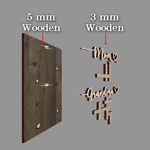 May include: Wooden family name signs. One sign is a dark brown wooden board with small wooden hearts and the words "FIRST" and "NOW". The other sign has the words "Mom" and "Grandma" with names.