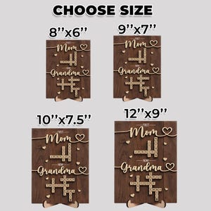 May include: Wooden family sign with the words "Mom" and "Grandma" in a cursive font, with names spelled out in a crossword puzzle style. The sign is available in four sizes: 8"x6", 9"x7", 10"x7.5", and 12"x9".
