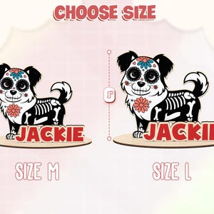 May include: Wooden dog-shaped decoration with a Day of the Dead theme. The dog is black and white with a skeleton design and floral accents. The name "JACKIE" is displayed in red. The text "CHOOSE SIZE" is at the top, with size options of 6" and 8".