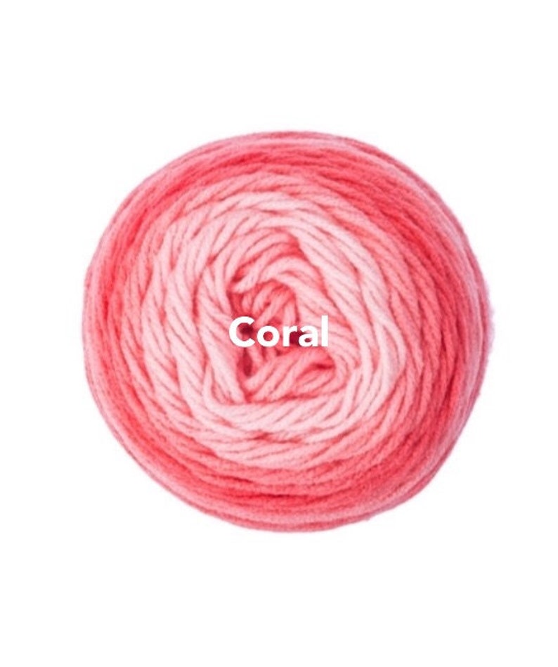 May include: A ball of coral-colored yarn, with a gradient effect from light pink to a deep coral hue. The word "Coral" is printed in white across the center of the yarn ball. Ideal for knitting and crochet projects.