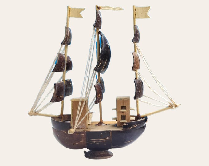Handcrafted Coconut Shell Sailboat Model: Nautical Home Decor