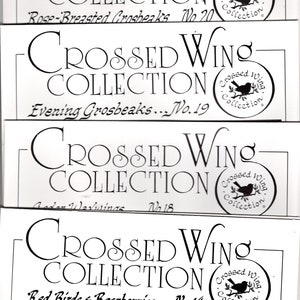 May include: Four different Cross Stitch patterns from the Crossed Wing Collection. The patterns are titled "Rose-Breasted Grosbeaks No. 20", "Evening Grosbeaks... No. 19", "Garden Warblers No. 18", and "Red Birds & Raspberries... No. 14".