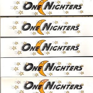 May include: Five white rectangular labels with black and yellow text that reads "ONE NIGHTERS" with a yellow crescent moon and gold stars.