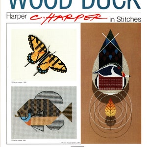 May include: A book cover for a cross-stitch pattern book titled "Wood Duck: Harper c/HARPER in Stitches". The cover features three cross-stitch designs: a butterfly, a wood duck, and a fish.