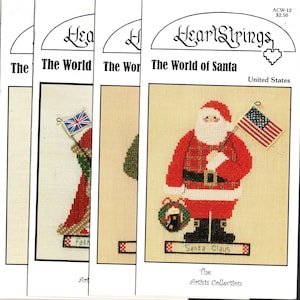 May include: A cross-stitch pattern featuring Santa Claus holding an American flag. The pattern is titled "The World of Santa" and is part of the "Artists Collection" by Heartstrings.