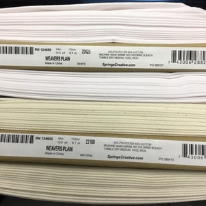 May include: Two rolls of fabric, one white and one natural, with labels that read "WEAVERS PLAIN." Each roll is 44 inches wide and 10 yards long. The labels also include care instructions and the website SpringsCreative.com.