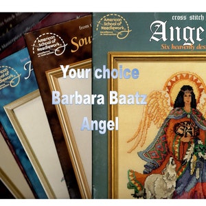 May include: Cross stitch pattern book featuring six designs of angels. The cover shows a colorful angel with a wolf and a sunburst behind her. The title of the book is "Angels" and the subtitle is "Six heavenly designs".