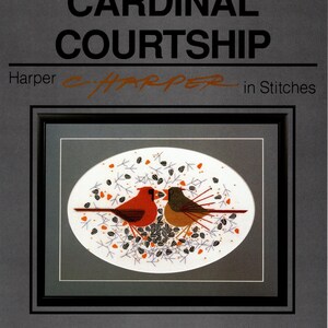 May include: A counted cross stitch pattern featuring two red cardinals perched on a branch with a background of scattered seeds. The pattern is titled "Cardinal Courtship" and is part of the "Harper in Stitches" counted collection.