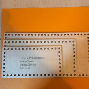 May include: Three rectangular wooden bases with evenly spaced holes for crafting. The largest base measures approximately 19.6cm by 10cm. The text on the middle base reads: "10cm x 19.6 Rectangle, 0.6cm Holes, 0.6cm Spacing, 44 Holes."
