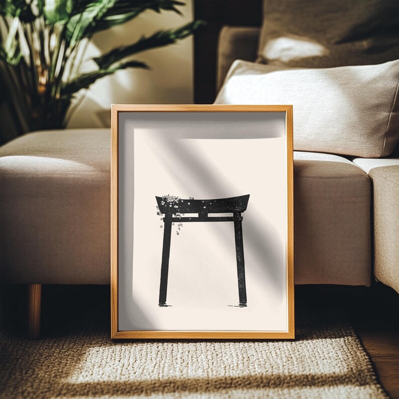 May include: A framed black and white print of a traditional Japanese torii gate with a floral design. The gate is set against a white background.