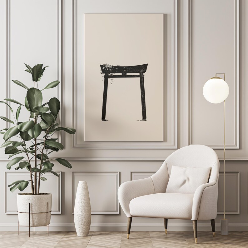 May include: A black and white illustration of a traditional Japanese torii gate, a gateway to a Shinto shrine, printed on a beige canvas. The canvas is framed and hanging on a white wall in a room with a white armchair and a floor lamp.