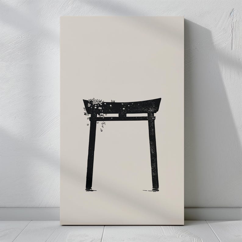 May include: A black silhouette of a traditional Japanese torii gate with white flowers hanging from the top. The gate is set against a light beige background.