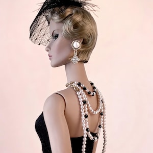 May include: A handmade, wooden serving tray with a natural finish. The tray features a rectangular shape with raised edges and integrated handles. The wood grain is visible, showcasing the tray's craftsmanship. Dimensions are approximately 16 inches long and 10 inches wide.