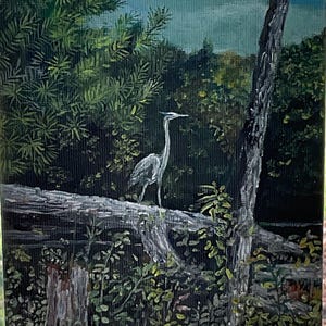 May include: An oil painting depicts a serene wetland scene. A gray heron stands on a fallen log, surrounded by lush green foliage and trees. The background features a cloudy blue sky, creating a tranquil nature scene.