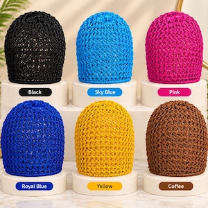 May include: Six crochet beanies in black, sky blue, pink, royal blue, yellow, and coffee colors. Each beanie features an open-knit pattern and is displayed on a white stand with a corresponding color label below it.