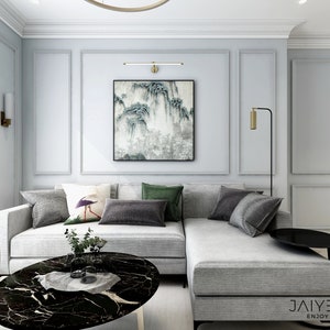 May include: A gray sectional sofa with a black and white abstract painting on the wall behind it. The sofa has several pillows in various colors and patterns. A black marble coffee table sits in front of the sofa. The room has a modern and minimalist design.