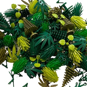 May include: A collection of green and brown plastic LEGO® tree pieces. The pieces include various types of trees, bushes, and leaves.