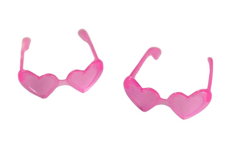 May include: Two pairs of pink heart-shaped sunglasses. The frames and lenses are a translucent pink. The sunglasses are a fun accessory, perfect for a themed party or a playful look.