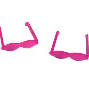 May include: Two pairs of bright pink sunglasses with a wavy frame design. The sunglasses have a classic shape with straight arms and a curved bridge. The frames and arms are a solid, vibrant pink color.