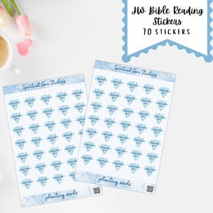May include: Two sheets of stickers with blue diamond designs, labeled "Spiritual Gem Stickers." The image includes a cup of coffee, a keyboard, pens, glasses, and pink flowers. The top right corner has a sign that says "JW Bible Reading Stickers 70 Stickers."