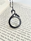 Black Swan Magnifying Glass Necklace: Antiqued Monocle Pendant product logo