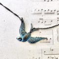 Flying Bird Necklace, metal bird pendant, teal green patina, rustic bird necklace, teal green bird charm necklace, Blue Bird Necklace product logo