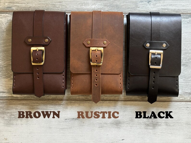 May include: Three leather pouches with a buckle closure. The pouches are brown, rustic brown, and black.