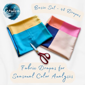 May include: Two fabric drapes in blue, yellow, pink, and navy colour blocks. The drapes are labelled "True Spring" and "Light Summer". Scissors are placed between the drapes. Text reads "Basic Set - 48 Drapes" and "Fabric Drapes for Seasonal Colour Analysis".