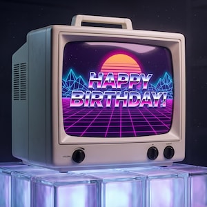 May include: A vintage-style off-white television set with a top handle and two black control knobs on the front. The screen displays a vibrant retro-themed graphic with a sunset, a purple grid landscape, and the text HAPPY BIRTHDAY in bold letters.