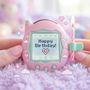 May include: A pink electronic pet device with a screen displaying "Happy Birthday!" and a heart icon. A lit pink candle is attached. The device is held against a soft, purple background with decorative elements.
