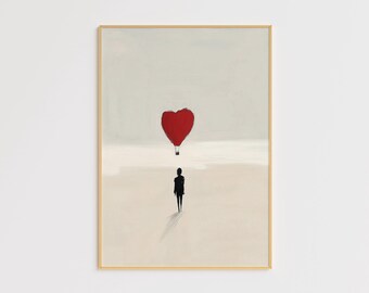 May include: A framed painting of a person walking towards a red heart-shaped hot air balloon in a light gray sky. The background is a light beige color.