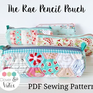 May include: Several Rae Pencil Pouches in various sizes and patterns are displayed. The pouches feature floral, geometric, and patchwork designs in shades of pink, blue, and white. Each pouch has a zipper closure and a small fabric loop. The text "The Rae Pencil Pouch" and "PDF Sewing Pattern" are visible.