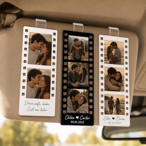 May include: Three rectangular car visor clips designed like film strips, featuring personalized photo collages of couples. Two clips are white with black text, and one is black with white text. The text reads Drive safe, babe Call me later, Chloe Carter 09.05.2025, and Ella Owen 10.12.2025.