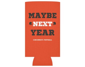 May include: Orange can cooler with black text that reads "MAYBE NEXT YEAR" with a football helmet graphic on either side of the word "NEXT". The text "CINCINNATI FOOTBALL" is printed below the main text.