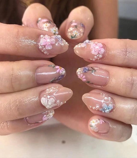 23 Pink Wedding Nails Ideas for a Romantic Bridal Look 3 Light pink nails with floral detailing